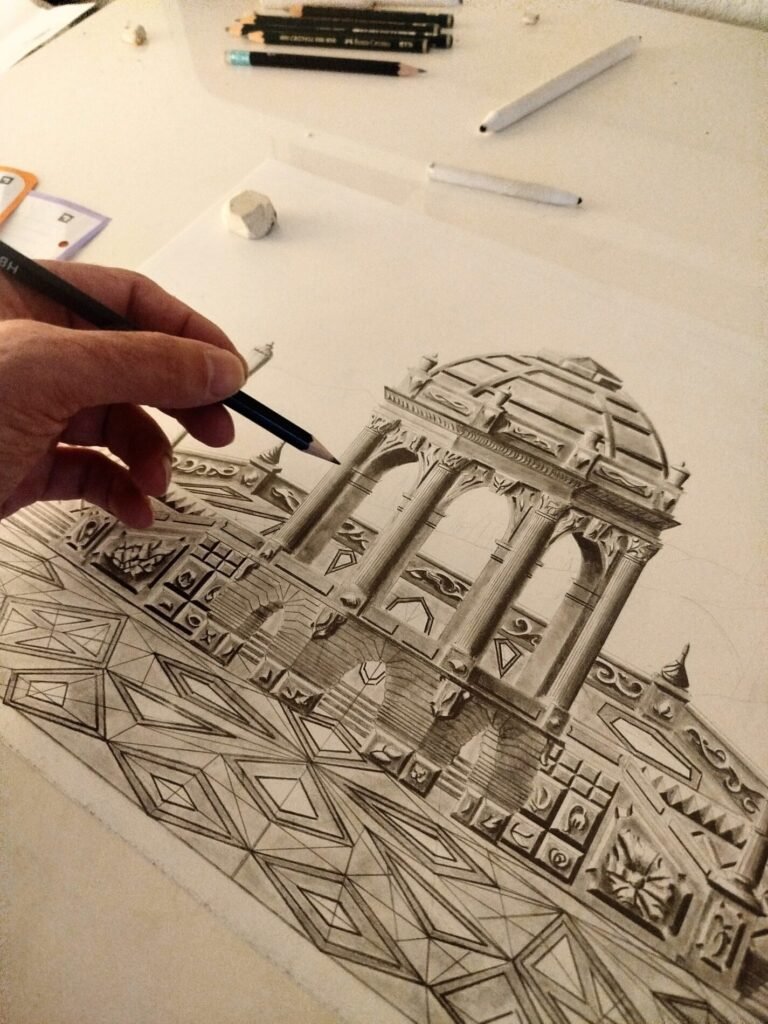 A detailed close-up photograph of the hand of the artist from Eldor Art, holding a graphite pencil and working on the complex geometric dome of the 'Belvedere of Syrabis' drawing on 180g Bristol paper.
